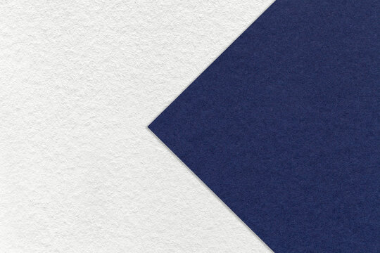 Texture Of Paper White Background, Half Two Colors With Navy Blue Arrow, Macro. Structure Of Dense Craft Cardboard