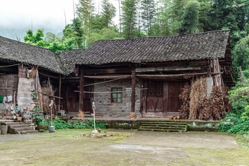 Facade of an old poor house in a village in the daytime