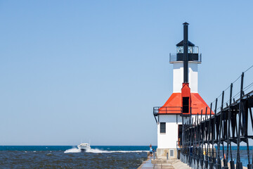Boat coming in the channel at St. Joseph North Pier Lighthouse, Michigan