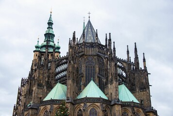 Low angle view of the Saint Vitus Cathedral against a cloudy sky - Powered by Adobe