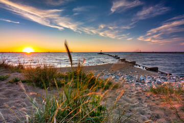 Sunset on the beach of the Baltic Sea in Gdansk, Poland