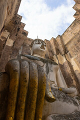 Close up of Buddha statue inside Sri Chum temple in Sukhothai Historic Park, a destination of tourist in Thailand