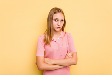 Young caucasian girl isolated on yellow background who is bored, fatigued and need a relax day.