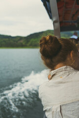 woman's hair from behind on a boat