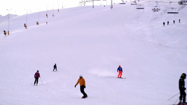 Levi ski resort, toboggan run, funicular cabins go uphill, , spruce in snow, beautiful winter landscape, concept holiday in lapland, winter sports, frosty air walks in forest, New Year's fairy tale