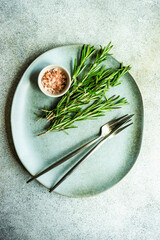 Table setting with fresh rosemary