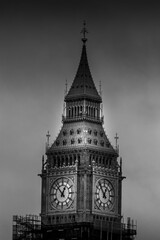 Vertical closeup of Big Ben shot in grayscale in London, England