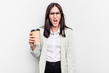 Fototapeta premium Young business caucasian woman holding takeaway coffee isolated on white background screaming very angry and aggressive.