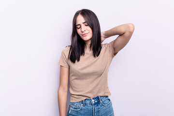 Fototapeta premium Young caucasian woman isolated on pink background suffering neck pain due to sedentary lifestyle.