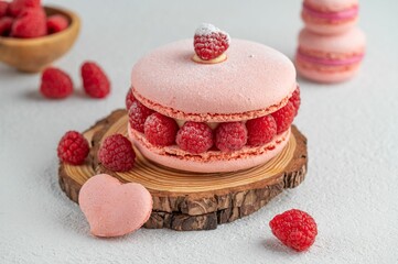 Closeup of a pink raspberry macaron