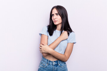 Young caucasian woman isolated on pink background confused, feels doubtful and unsure.