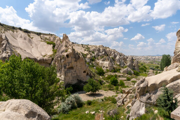 Fototapeta na wymiar Landscape of Goreme, in Cappadocia, with the typical rocks there on a sunny day with some clouds.