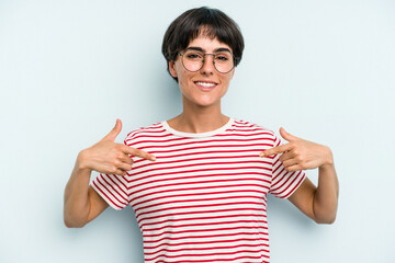 Young caucasian woman with a short hair cut isolated points down with fingers, positive feeling.