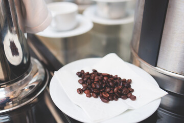 Set of coffee break in the hotel restaurant during conference meeting, with tea and coffee catering, decorated banquet table with white tableware and metal tea maker machine boiler