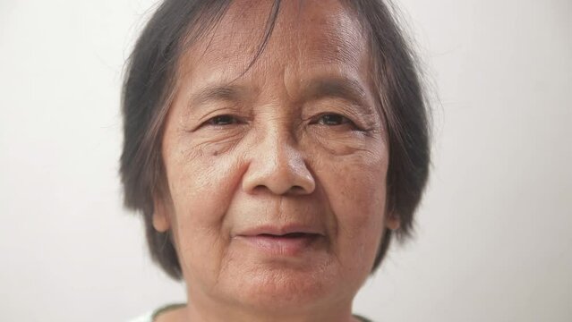 Happy smiling Asian elderly woman face. concept of health care for the elderly in retirement age