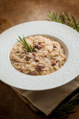 Risotto with sausage with red wine and rosemary