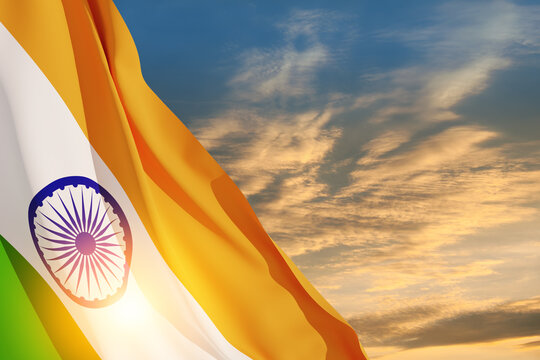 Waving India flag on sunset sky. Background with place for your text. Indian independence day, 15 August. 3d-rendering.