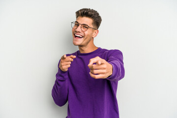 Young caucasian man isolated on white background cheerful smiles pointing to front.
