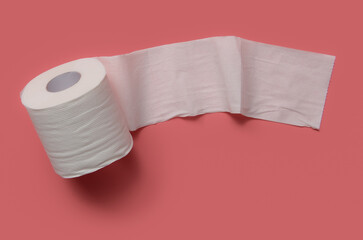 Roll of toilet paper on a pink background. - 520637279