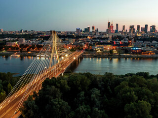 Naklejka na ściany i meble Poland, Warsaw capital city during twilight. Aerial drone view.