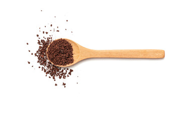 A wooden spoon with instant coffee on the table