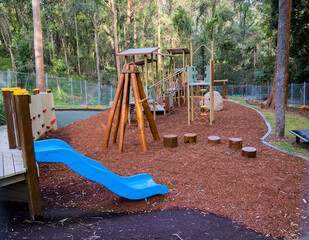 Kids playground with swings and a slide