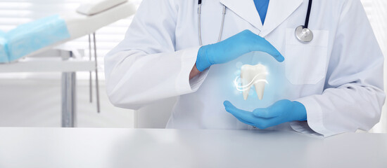 Dentist demonstrating virtual model of healthy tooth indoors, closeup. Banner design - obrazy, fototapety, plakaty