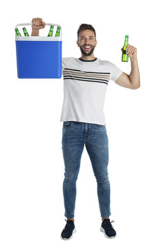 Happy man with cool box and bottles of beer on white background