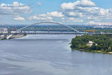 View of the new automobile cable-stayed bridge across the Dnipro river in Kyiv on a summer day.