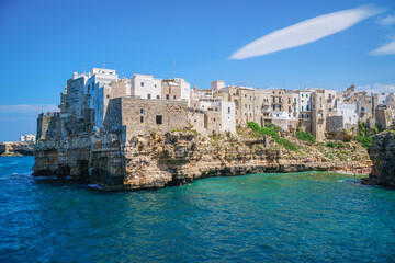 Coast of Polignano a Mare and beach with tourists, Puglia, Italy