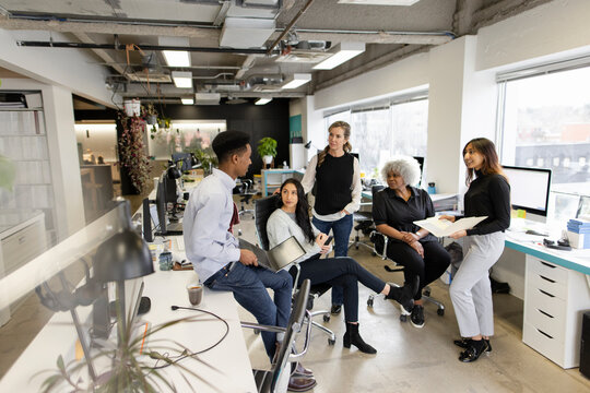 Business People Meeting In Open Plan Office