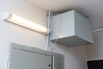 Electric cabinet with Internet and television cables in an apartment building. Niche for wires and...