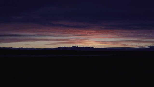 Colorful sunrise on the horizon over the mountains in Iceland