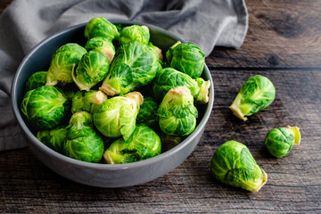 Fresh Brussels Sprouts in a Grey Ceramic Bowl: Overhead view of Brussels sprouts piled in a porcelain bowl
