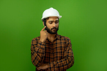 in thinking an engineer with notebook or sketch book handsome man or architect with white safety helmet in green screen