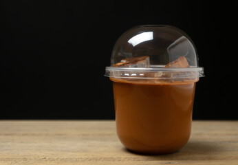 Ice milk tea sweet drink blurred on black