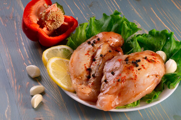 marinated chicken fillet on a white plate