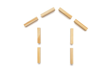 House shape from wooden rectangles on a white background. The concept of building or purchasing...
