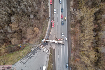Aerial view of road accident with overturned truck blocking traffic - obrazy, fototapety, plakaty