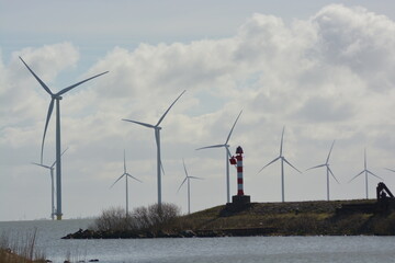 Wind turbines at Amstelmeer, Netherlands. Dutch windmill park in the North sea. Space for text.