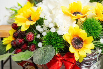 Obraz na płótnie Canvas Multicolored, fake fabric flowers arrangement
