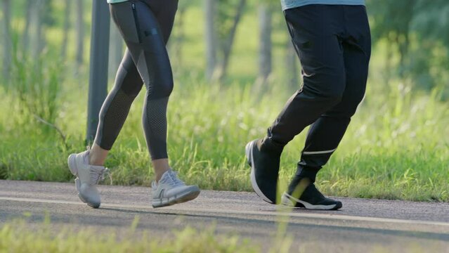 Happy mature couple running in park,4K