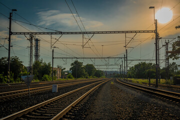 Railway yard in Prague Holesovice station in summer cloudy evening