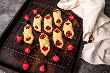Kolacky with Raspberry. Pastry with jelly and cream. Polish Kolaczki cookies, freshly baked