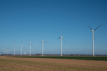 North Holland, Netherlands, March 2022. Wind turbines in the polder landscape of North Holland.
