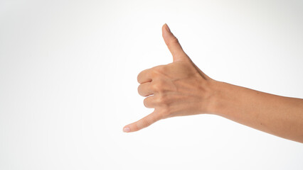 woman's hand gesture greeting surfers shaka thumb and little finger protruded