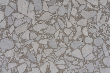 Stone mosaic, close-up of gray natural stone mosaic as background of a picture. Copy space for your design. Web banner. 