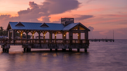 Pier at the beach in Key West, Florida USA with powerful and beautiful sky