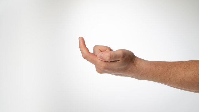 A man's hand gesture to call a finger to himself like a hook