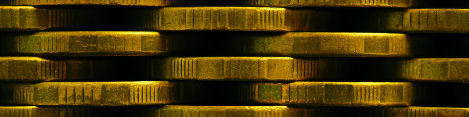 Stack of coins close-up. Coin texture. Business banner made of many coin edge. Economy finance and...